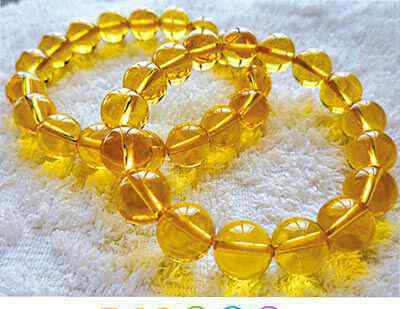 巴西黄水晶 黄水晶的硬度为七，宝石级的黄水晶极为稀有，以橘黄色的为上品，黄水晶能量强烈，俗称财富之石，能增强气场